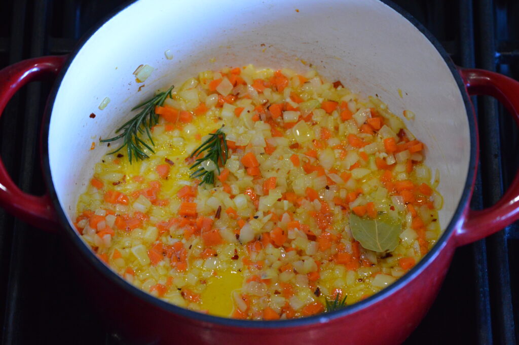 sautéing the vegetables, herbs, and aromatics