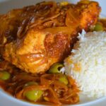 the finished chicken yassa with a side of rice
