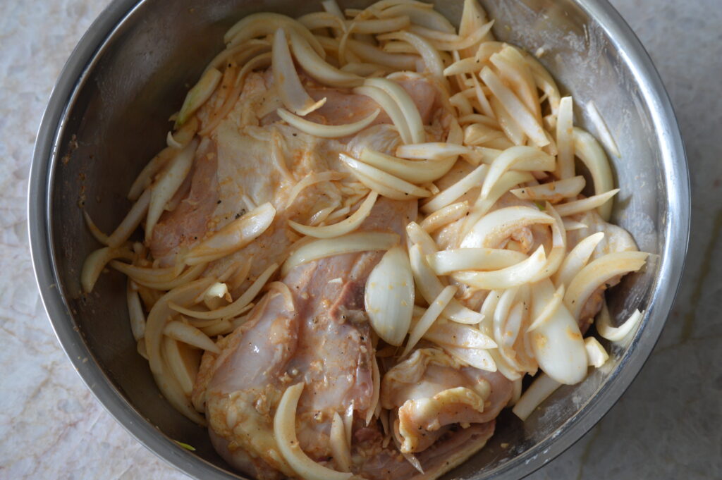 the chicken and onions are marinating