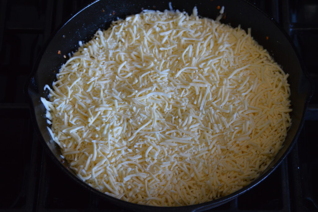 the cheese is added and begins to melt