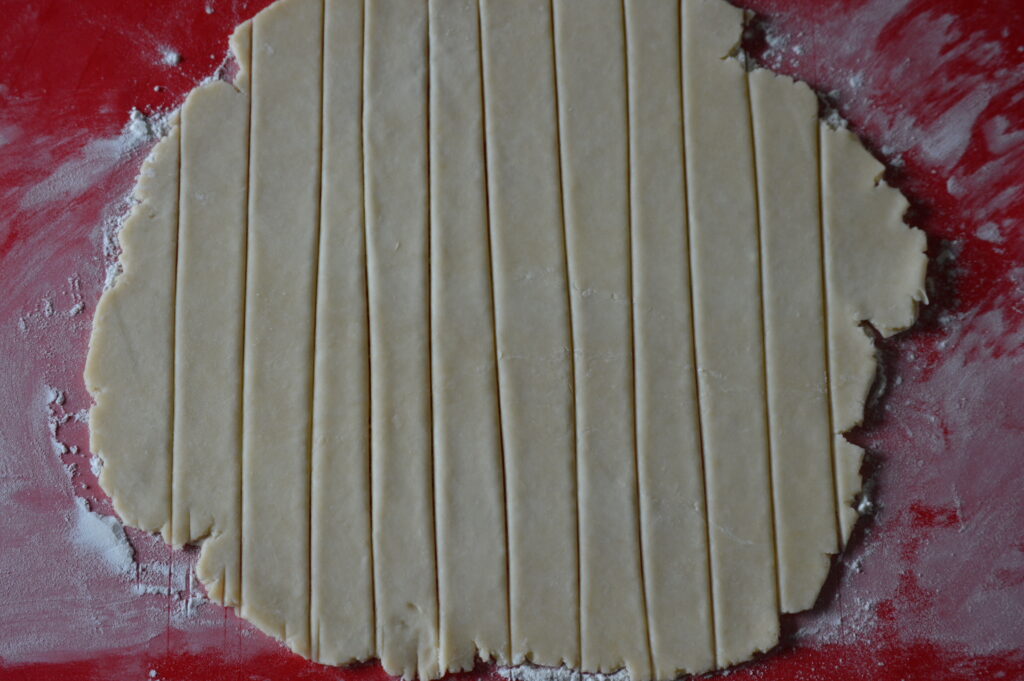 cutting the pie crust into strips