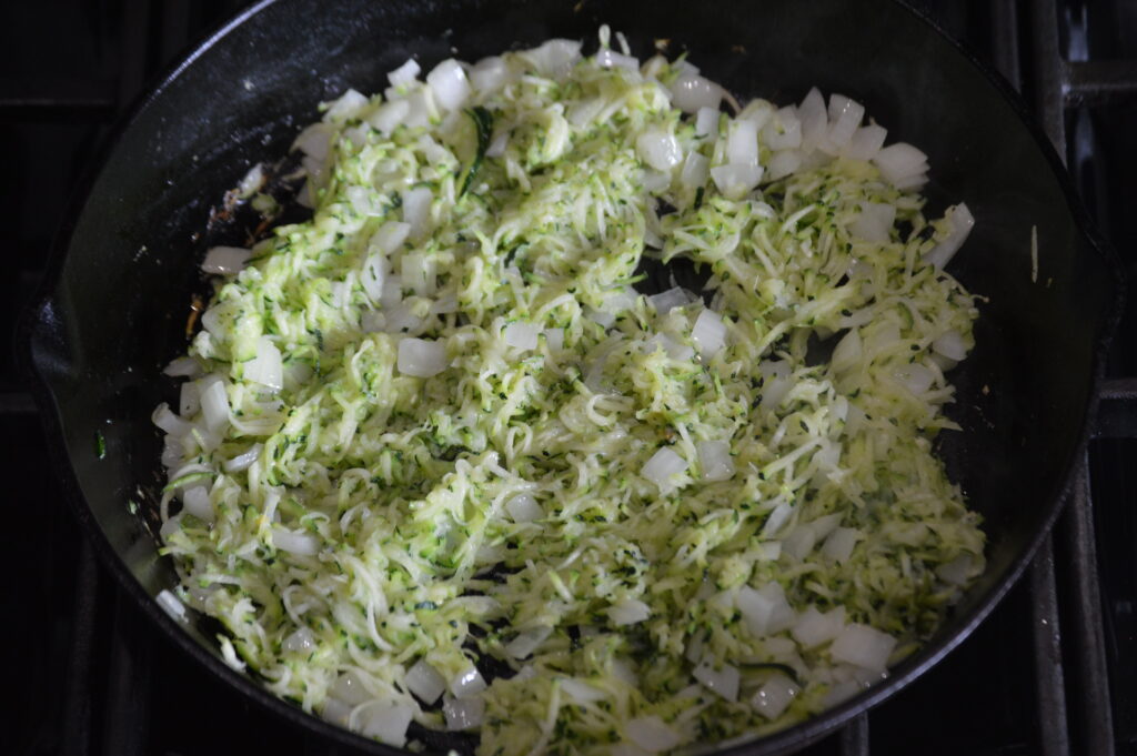 sautéing the zucchini and onion
